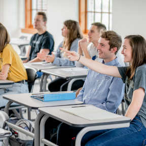 Student Pointing at Board
