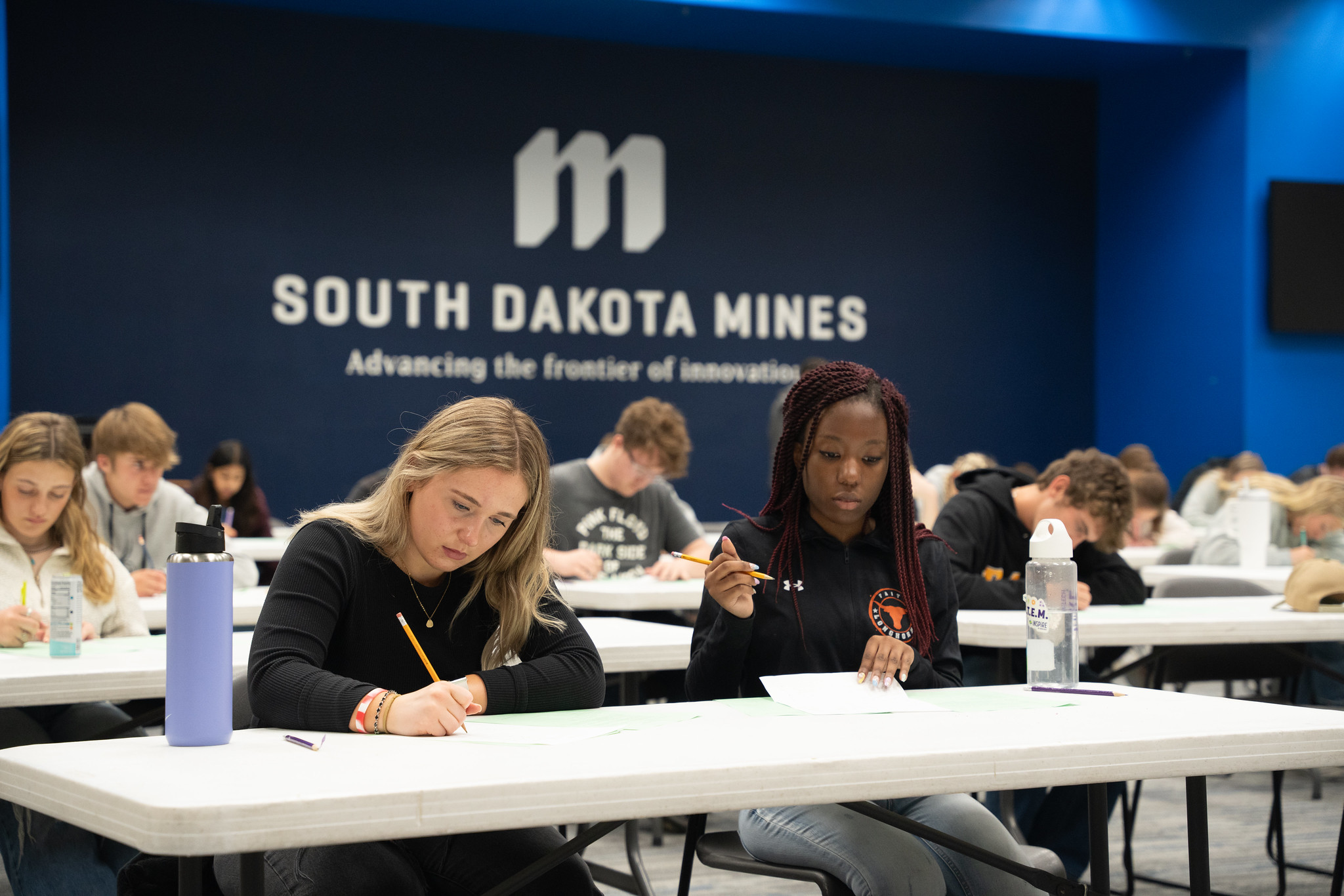 two girls taking a test